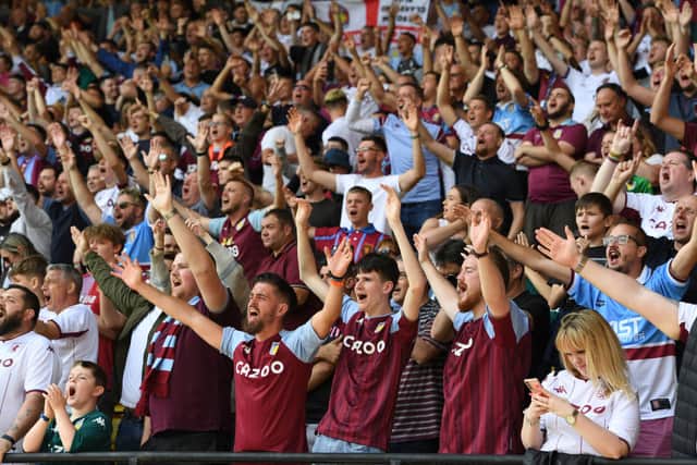 Fans of Aston Villa show their support for their team during the Premier League match between Watford and Aston Villa at Vicarage Road on August 14, 2021 in Watford, England.