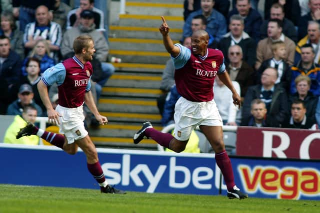 NEWCASTLE - APRIL 21:  Dion Dublin of Aston Villa celebrates scoring the equalising goal with team-mate Olof Mellberg during the FA Barclaycard Premiership match between Newcastle United and Aston Villa held on April 21, 2003 at St James' Park, in Newcastle, England. The match ended in a 1-1 draw. (Photo by Mike Finn-Kelcey/Getty Images)