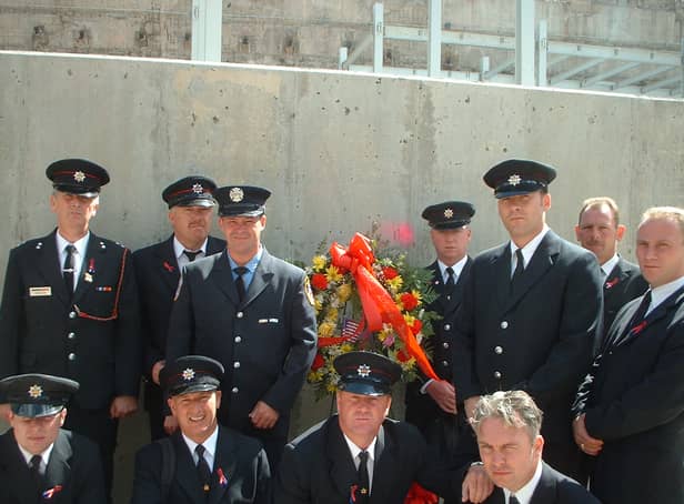 <p> Paul Smith (bottom row right centre) and Andy Horan (bottom row left centre), with fellow firefighters laying the wreath at ground zero on the first anniversary of 9/11</p>