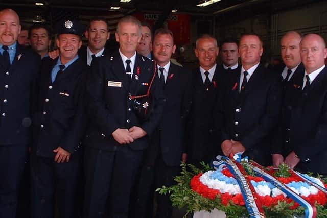 Paul (far right) pictured with fire fighters from the West Midlands Fire Service after the memorial mass on the first anniversary of 9/11 in 2002 at the Harlem Zoo Fire House in New York