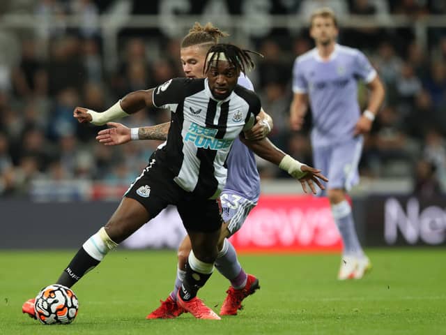 Kalvin Phillips of Leeds United vies with Allan Saint- Maximim of Newcastle United during the Premier League match between Newcastle United and Leeds United at St. James Park on September 17, 2021 in Newcastle upon Tyne, England. 