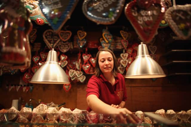 Stall holder Mira Heegner, from Bavaria, prepares her sweet and nut stall at Birmingham’s Frankfurt Christmas market in 2011 (Photo by Christopher Furlong/Getty Images)