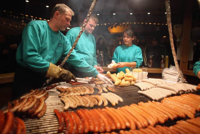 Chefs cook traditional German sausages over an open fire at Birmingham’s Frankfurt Christmas market on November 23, 2011 (Photo by Christopher Furlong/Getty Images)