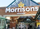Shoppers outside the front of a Morrisons store in Hatch End, London.