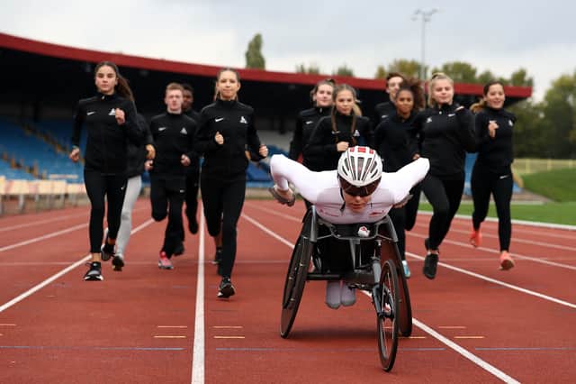 Team England para athletics star Nathan Maguire with members of Birchfield Harriers at the Alexander Stadium, which will host the athletics competition at the Games (Photo by Bryn Lennon/Getty Images)