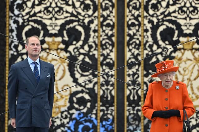 The Queen, accompanied by Prince Edward, Earl of Wessex, launches the Queen’s Baton Relay for the Birmingham 2022 Commonwealth Games (Photo by JUSTIN TALLIS / AFP) (Photo by JUSTIN TALLIS/AFP via Getty Images)