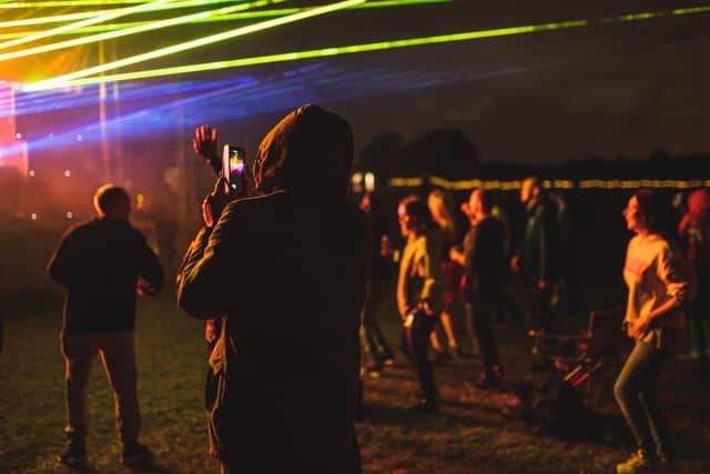 Crowd at an open air electronic music festival with social distancing measures near Birmingham