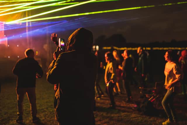 Crowd of an open air electronic music festival with social distancing measures near Birmingham 