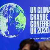 Sir David Attenborough pictured with the COP26 logo before the climate change summit was postponed due to the Covid-19 pandemic (image: Getty Images)