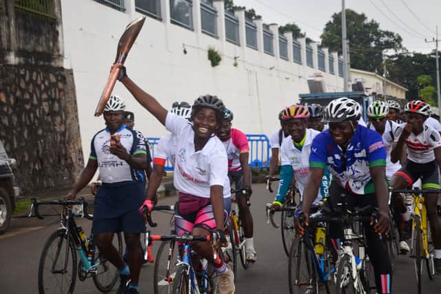 Deborah Conteh of the Sierra Leone Cycling Association holds the Birmingham 2022 Queen’s Baton Relay as it travels through the Commonwealth