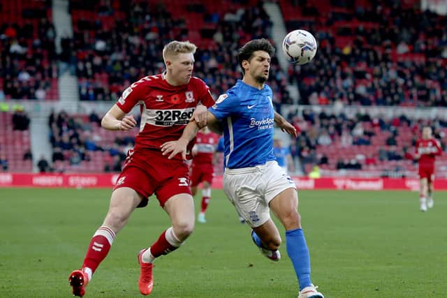 Josh Coburn (L) of Middlesbrough in action with George Friend of Birmingham City during the Sky Bet Championship match between Middlesbrough and Birmingham City at Riverside Stadium