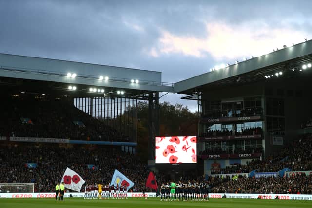 Players, officials and fans observe a minutes silence as part of the Remembrance Day proceedings prior to the Premier League match between Aston Villa and West Ham United at Villa Park