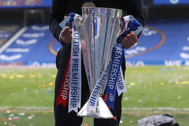 Rangers Manager Steven Gerrard is seen with the Scottish Premiership trophy during the Scottish Premiership match between Rangers and Aberdeen on May 15, 2021 in Glasgow, Scotland.