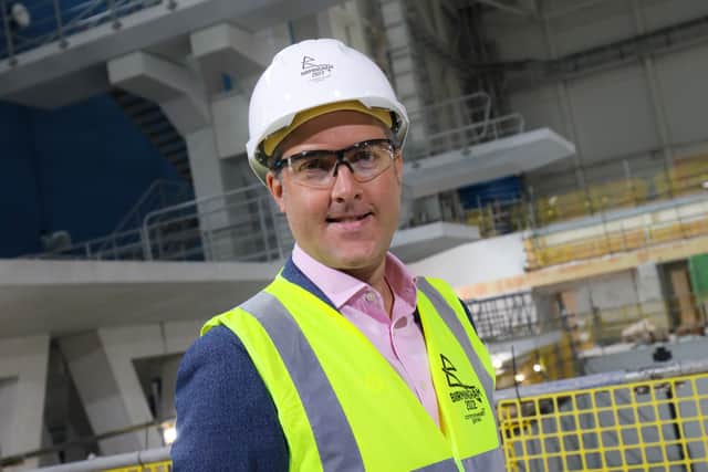 Ian Reid, CEO of Birmingham 2022, in front of the dive tower at the Sandwell Aquatics Centre