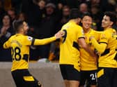 Hwang Hee-chan of Wolverhampton Wanderers celebrates with Rayan Ait-Nouri, Joao Moutinho and Raul Jimenez after scoring their team's first goal which is later ruled out by VAR