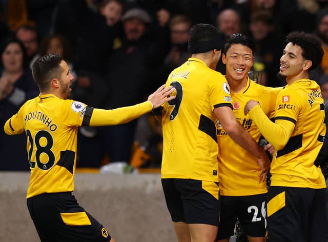 Hwang Hee-chan of Wolverhampton Wanderers celebrates with Rayan Ait-Nouri, Joao Moutinho and Raul Jimenez after scoring their team's first goal which is later ruled out by VAR