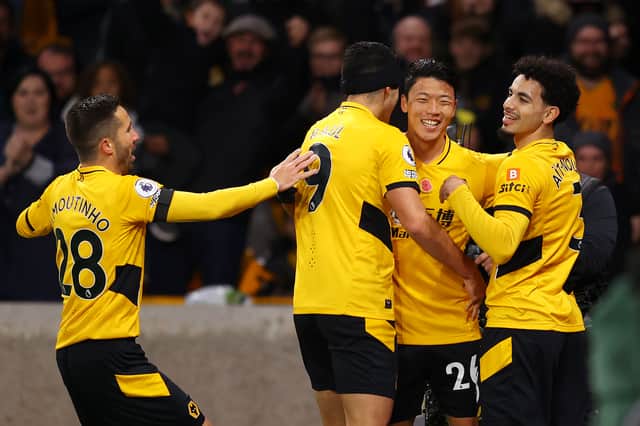 <p>Hwang Hee-chan of Wolverhampton Wanderers celebrates with Rayan Ait-Nouri, Joao Moutinho and Raul Jimenez after scoring their team's first goal which is later ruled out by VAR</p>
