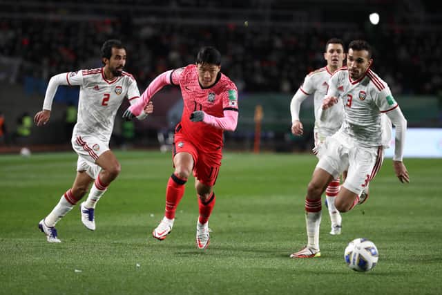 Hwang Hee-Chan of South Korea competes for the ball with Walid Abbas albalooshi of United Arab Emirates during the FIFA World Cup Asian Qualifier Final Round Group A between South Korea and United Arab Emirates