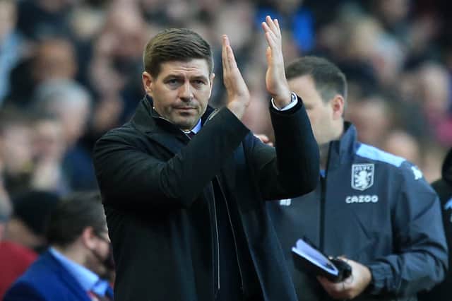 <p>Aston Villa's new English head coach Steven Gerrard applauds supporters as he arrives to take his first game ahead of the English Premier League football match between Aston Villa and Brighton and Hove Albion at Villa Park</p>