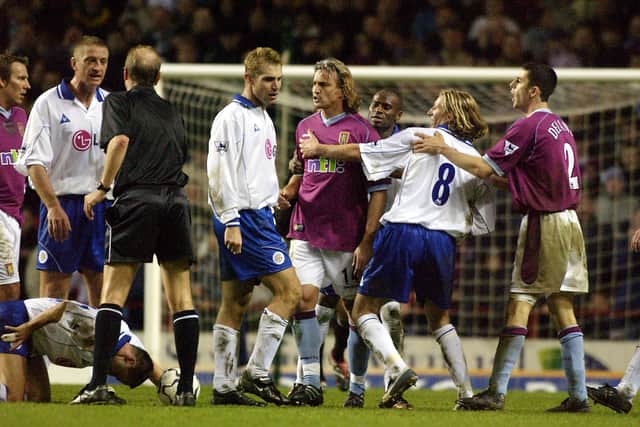 David Ginola of Aston Villa is shown a red card after a tackled on Dennis Wise of Leicester during the FA Barclaycard Premiership match between Aston Villa and Leicester City at Villa Park