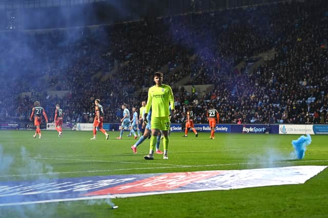 Matija Sarkic of Birmingham City looks on after a flare has been thrown on to the pitch during the Sky Bet Championship match between Coventry City and Birmingham City at The Coventry Building Society Arena
