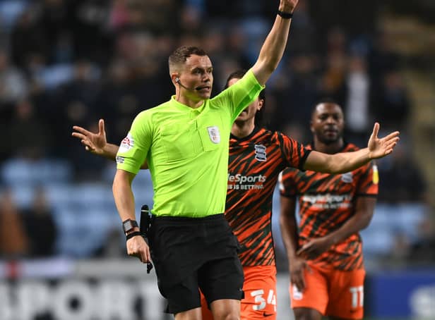 <p>Match referee Leigh Doughty shows a red card to Ryan Woods of Birmingham City (not pictured) during the Sky Bet Championship match between Coventry City and Birmingham City at The Coventry Building Society Arena</p>