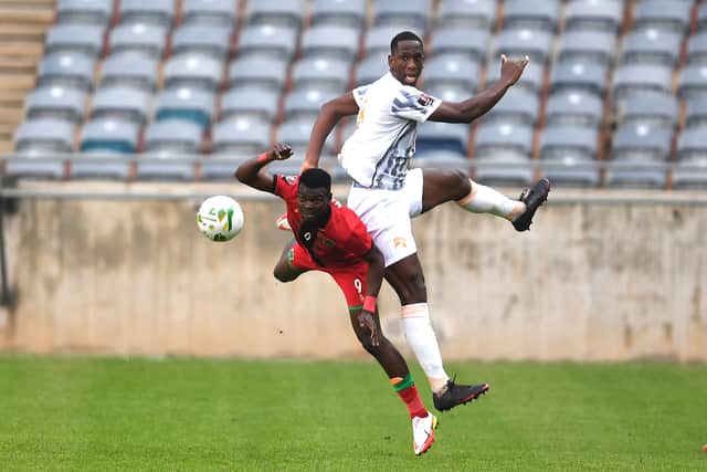 Richard Mbulu of  Malawi and Willy Boly of Cote d'Ivoire during the 2022 FIFA World Cup Qatar, Qualifier match between Malawi and Cote d'Ivoire at Orlando Stadium on October 08, 2021 in Johannesburg, South Africa