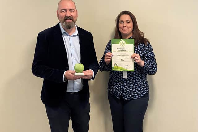 Touchwood Solihull's General Manager Tony Elvin and Lynsey Riley, Projects and Compliance Manager proudly display their Green Apple Trophy