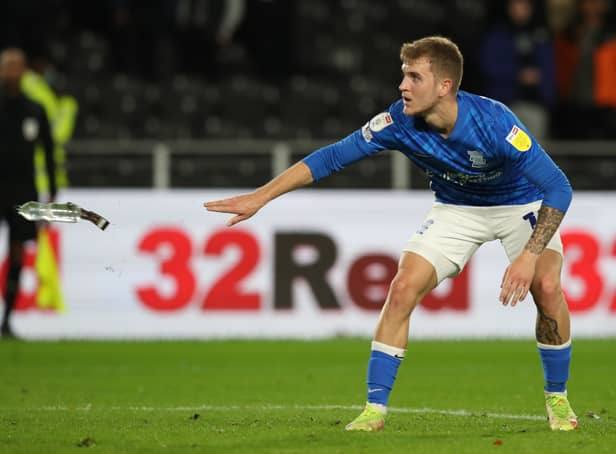 <p>Riley Mcgree of Birmingham City throws a bottle off the pitch during the Sky Bet Championship match between Hull City and Birmingham City</p>