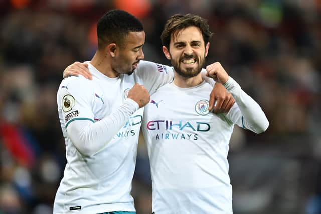 Bernardo Silva of Manchester City celebrates with teammate Gabriel Jesus after scoring their side's second goal during the Premier League match between Aston Villa and Manchester City at Villa Park