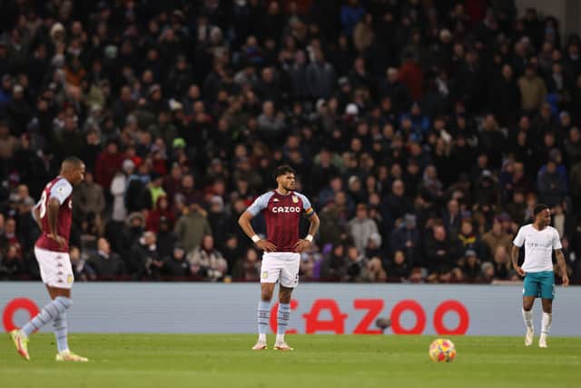 Tyrone Mings of Aston Villa reacts after Manchester City score a second goal scored by Bernardo Silva (not pictured) during the Premier League match between Aston Villa and Manchester City