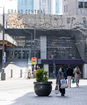 A woman wearing a mask at Grand Central Station in Birmingham city centre during coronavirus pandemic