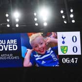 An LED board inside the stadium shows a photo of Arthur Labinjo-Hughes as fans hold a minutes applause in his memory during the Premier League match between Tottenham Hotspur and Norwich City at Tottenham Hotspur Stadium on December 05, 2021 in London, England. (Photo by Mike Hewitt/Getty Images)