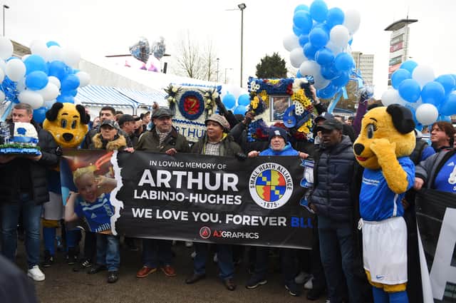 Birmingham City supporters carry banners and wreaths in tribute to Arthur Labinjo-Hughes at  St Andrew’s (Photo by Tony Marshall/Getty Images)