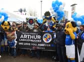 Birmingham City supporters carry banners and wreaths in tribute to Arthur Labinjo-Hughes at  St Andrew’s (Photo by Tony Marshall/Getty Images)