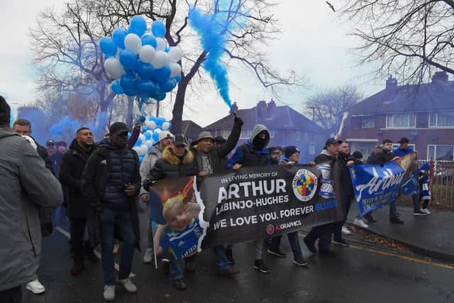 Supporters of Birmingham City walk to St Andrew’s carrying banners and wreaths in tribute to Arthur Labinjo-Hughes (Photo by Tony Marshall/Getty Images)