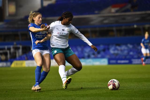 Khadija Shaw of Manchester City Women runs past Rebecca Holloway of Birmingham City Women during the Barclays FA Women’s Super League match at St Andrew’s Trillion Trophy Stadium on December 12 (Photo by Nathan Stirk/Getty Images)