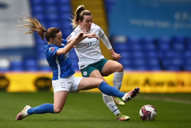 Lauren Hemp of Manchester City Women is tackled by Harriet Scott of Birmingham City during the Barclays FA Women’s Super League match at St Andrew’s Trillion Trophy Stadium on December 12, 2021 (Photo by Nathan Stirk/Getty Images)