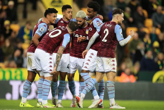 Ollie Watkins of Aston Villa celebrates with team mates after scoring their side's second goal during the Premier League match between Norwich City and Aston Villa at Carrow Road