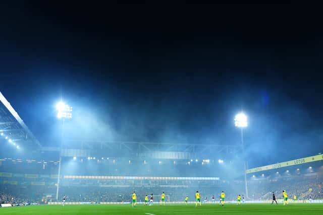 A general view inside the stadium as smoke is seen during the Premier League match between Norwich City and Aston Villa at Carrow Road
