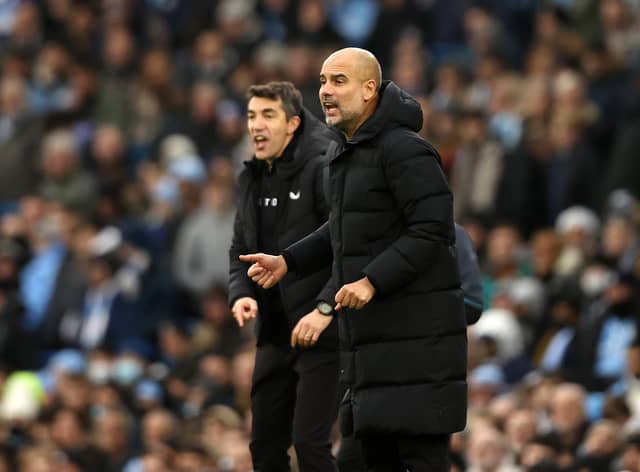 Bruno Lage, Manager of Wolverhampton Wanderers and Pep Guardiola, Manager of Manchester City react on the side line during the Premier League match between Manchester City and Wolverhampton Wanderers
