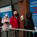 Members of the public arrive at the new seven day vaccination centre at Villa Park (Photo by Jacob King - Pool/Getty Images)