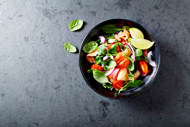 Salmon Salad with spinach, cherry tomatoes, corn salad, baby spinach, fresh mint and basil (Shutterstock image - not from Choppaluna)