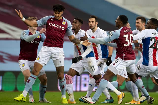 Wilfried Zaha of Crystal Palace and Tyrone Mings of Aston Villa clash during the Premier League match between Aston Villa and Crystal Palace at Villa Park on December 26, 2020