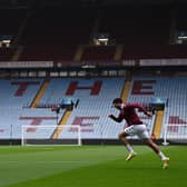 A player of Aston Villa trains as the game is postponed due to COVID-19 prior to the Premier League match between Aston Villa  and  Burnley at Villa Park