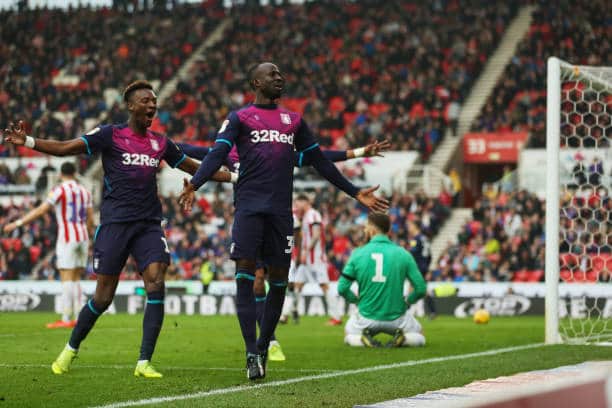 Albert Adomah celebrates with team-mates after his equaliser at Stoke City. Picture by Molly Darlington - AMA/Getty Images