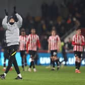 Thomas Tuchel, Manager of Chelsea applauds the fans following the Carabao Cup Quarter Final match between Brentford and Chelsea at Brentford Community Stadium