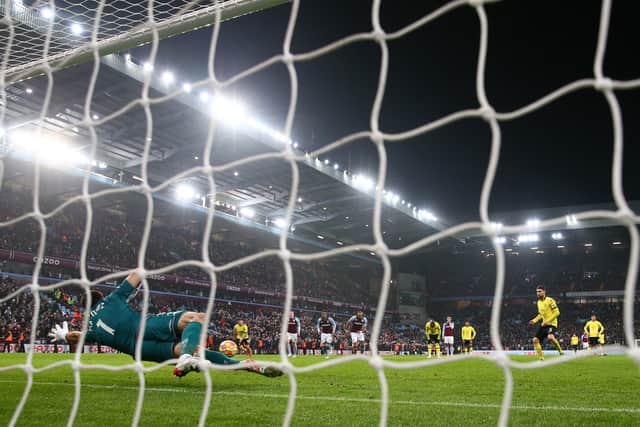 Jorginho of Chelsea scores their side's third goal from the penalty spot past Emiliano Martinez of Aston Villa during the Premier League match between Aston Villa and Chelsea at Villa Park