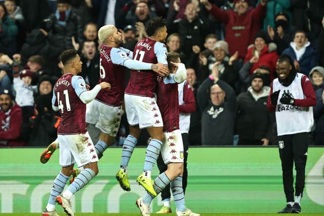 Players of Aston Villa celebrate their side's first goal, an own goal by Reece James of Chelsea (not pictured) during the Premier League match between Aston Villa and Chelsea at Villa Park