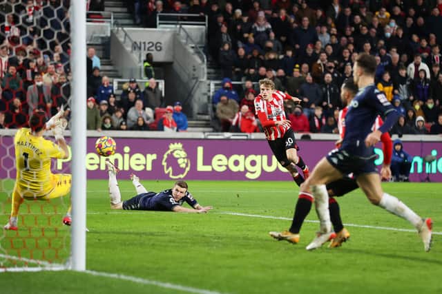Mads Roerslev of Brentford has a shot saved which he then follows up to score the re-bound for Brentford's second goal during the Premier League match between Brentford and Aston Villa